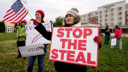 Supporters of President Donald Trump gather outside of the Wyndham Hotel in Gettysburg where the Pennsylvania State Senate Majority Policy Committee held a meeting on election fraud that Trump called into.