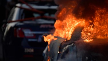An Atlanta Police Department vehicle burns during a demonstration against police violence in Atlanta on Friday.