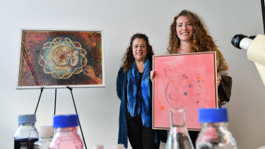 Artists Elena Theodoridi, left, and Candice McGaw with their artworks at the Australian Institute of Regenerative Medicine.