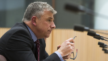 7-Eleven chief executive Angus McKay gives evidence at the inquiry. 