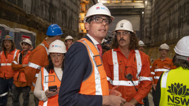 NSW Treasurer Dominic Perrottet with Sydney Metro workers on Thursday.