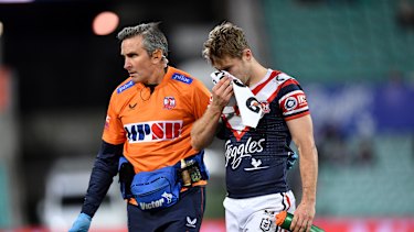 Sam Walker leaves the field after the Felise Kaufusi contact.