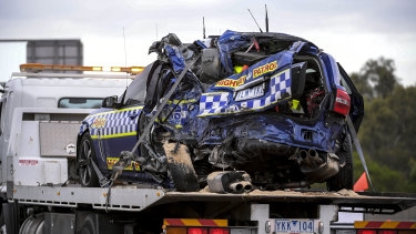 A police vehicle is removed from the scene of the crash in Kew in April 2020.