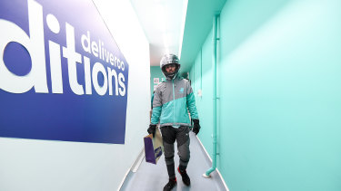 A delivery rider takes an order from Deliveroo's dark kitchen in Windsor. 