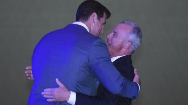 The Director of the Australian War Memorial Brendan Nelson (right) hugs Ben Roberts-Smith.