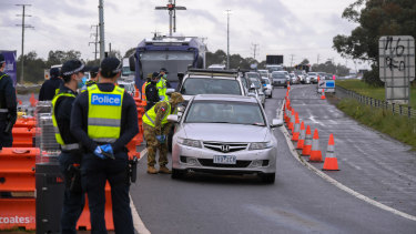 Police and Australian Defence Force personnel at the Little River checkpoint on Thursday.