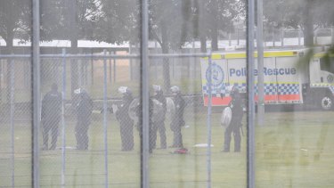 Riot police at the scene on Monday morning.