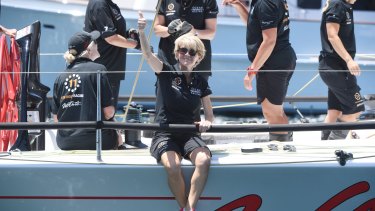 Julie Bishop gives onlookers the thumbs up as she prepares to jump off Wild Oats X.