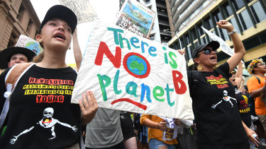 School students take part in the climate change strike in Brisbane.