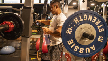 Marcelo Alexander cleaning equipment at City Gym.