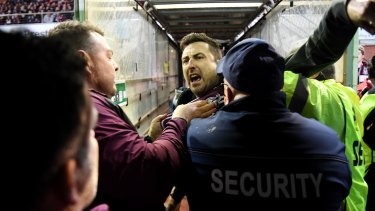 Security and police swooped on a Manly fan, centre, who confronted Melbourne Storm’s Will Chambers on Saturday night at Lottoland.