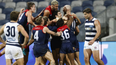 Max Gawn is mobbed after kicking the match-winning goal after the siren.
