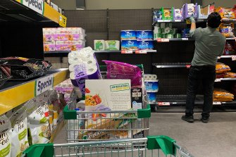 Toilet paper in a shopping trolley in a Woolworths supermarket on Friday. 