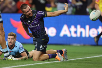 Cameron Munster flicks the ball away after scoring a try in his outstanding performance against Cronulla.