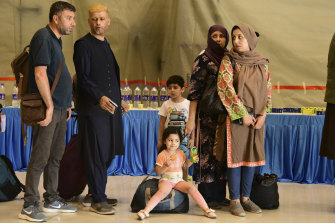 People evacuated from Kabul arrive at Hindon Air force base near New Delhi, India on Sunday. Their flight carried 168 people, according to an Indian government spokesman.
