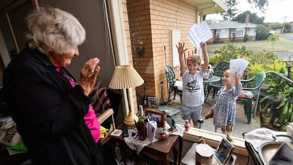 Willow Fedke (3) and Leo Fedke (6) are writing letters to their elderly neighbours. Here they are with 86-year-old Maureen.