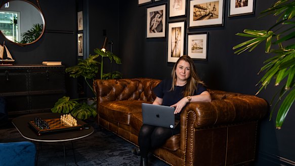 Alecia Rathbone working at a break out space at Custom's House. 