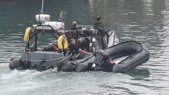 A dinghy used by migrants is brought in to port by a Border Force vessel in Dover, England.