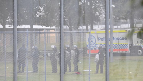 Riot police at the scene on Monday morning.