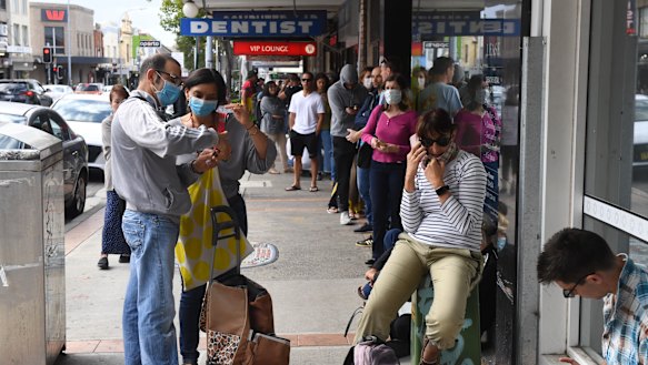 People queue at Centrelink in Sydney. 