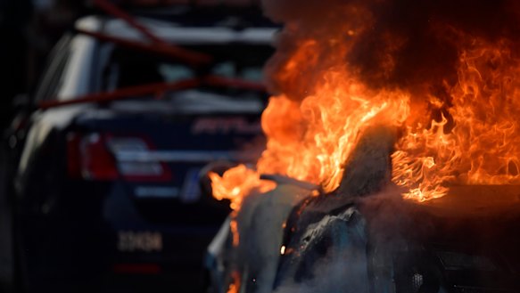 An Atlanta Police Department vehicle burns during a demonstration against police violence in Atlanta on Friday.