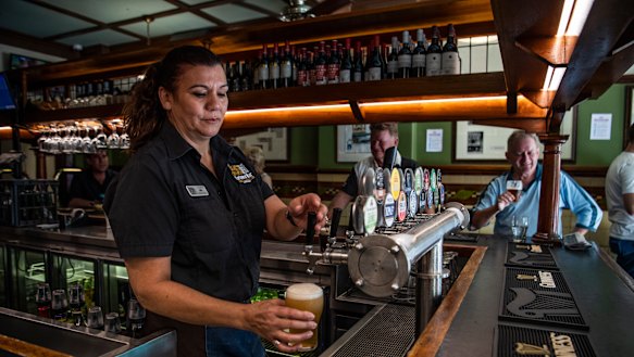 Bartender Jennifer Rounds pouring last drinks at Fortune of War, Sydney's oldest pub, before it closed its doors at noon.