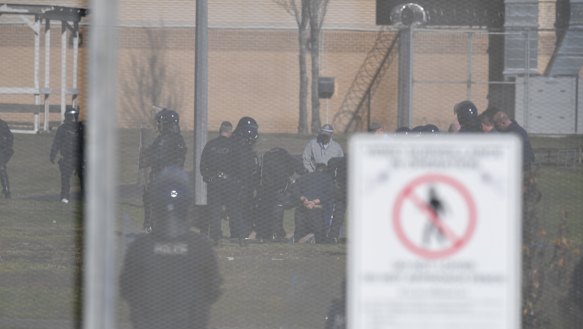 Detainees being arrested.
