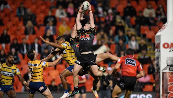 Liam Martin flies high to pull in a Nathan Cleary kick on Friday night.