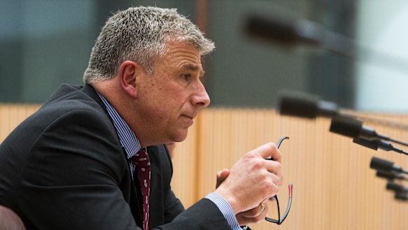 7-Eleven chief executive Angus McKay gives evidence at the inquiry. 
