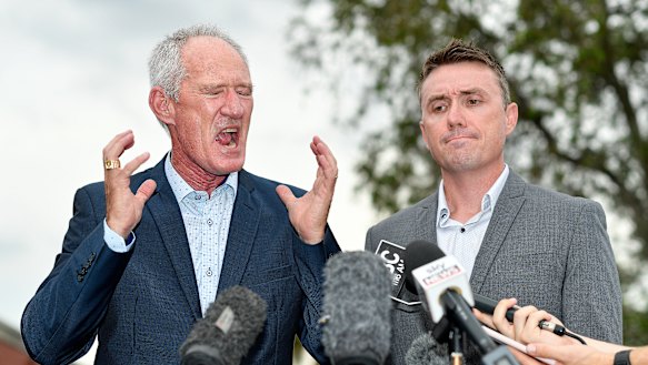 One Nation officials Steve Dickson and James Ashby answer questions at a press conference in Brisbane.