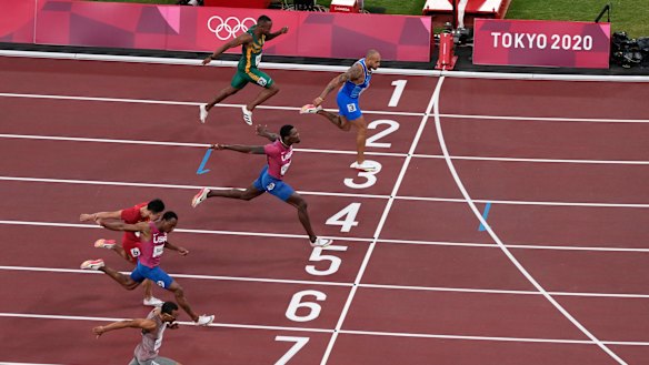 Lamont Marcell Jacobs finishes first in the men’s 100m final. 