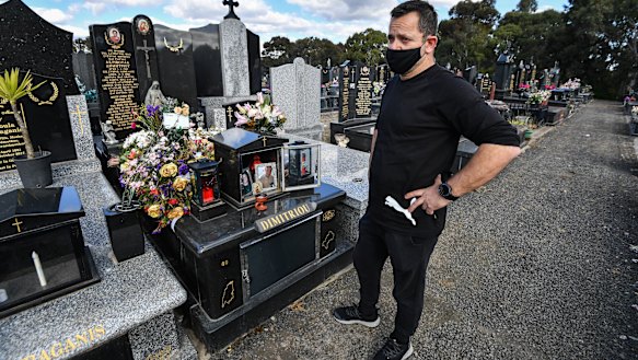 Spiros Dimitriou at his father John’s grave, at the Northern Memorial Park in Glenroy. John died after acquiring a coronavirus infection at St Basil's after living there for almost three years.