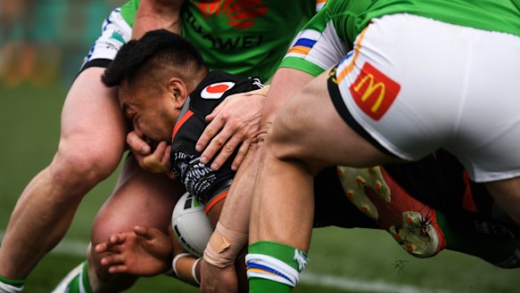 Footage shows Hudson Young of the Raiders with his hand in the face of Adam Pompey.