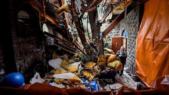 John Carlyle in his Kalorama home, which was partly destroyed by five falling trees.