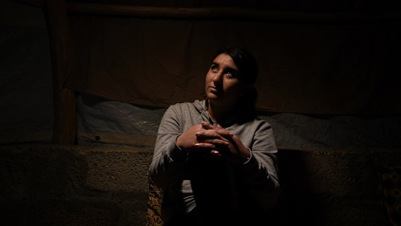 Ilham Dakhel Ali, 18, sits in the shelter she shares with her mother and youngest brother in Khanke IDP camp in Dohuk Governate of Iraqi Kurdistan. 