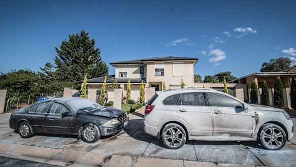 Police officers and forensic staff have attended the scene of an overnight shooting and arson attack in Kambah on Monday.