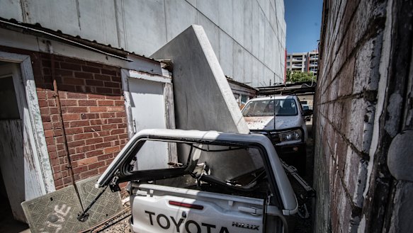 The pre-cast concrete panel that fell on the toilet block of Braddon Smash Repairs is expected to be removed on Friday.