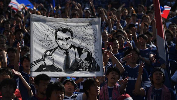 F. Marinos fans hold up a banner saluting Postecoglou as "brave and challenging".