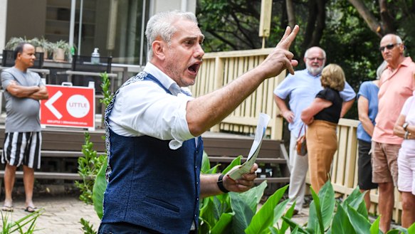 Auctioneer Tom Panos at a three-bedroom property in Lane Cove that on Saturday sold for $500,000 above the reserve.