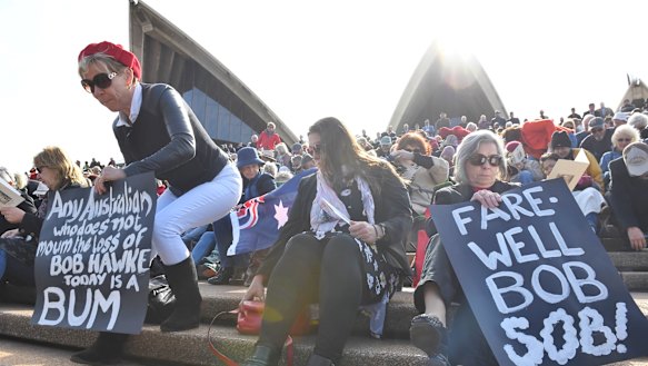 Hundreds gather on the Opera House steps for Bob Hawke's memorial service in Sydney.