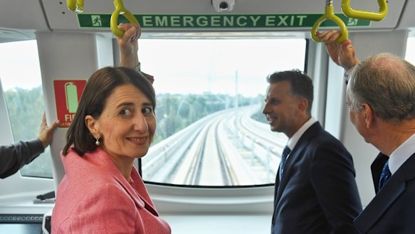 Premier Gladys Berejiklian and Andrew Constance on a driverless metro train undergoing testing in March.