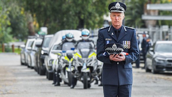 Deputy Commissioner of Victoria Police Rick Nugent with Constable Glen Humphris’ police hat.
