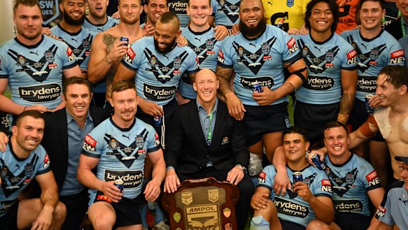 Craig Fitzgibbon celebrates an Origin series win one last time with the players.