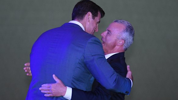 The Director of the Australian War Memorial Brendan Nelson (right) hugs Ben Roberts-Smith.