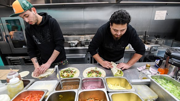 Chefs at work inside Deliveroo's dark kitchen in Windsor. 