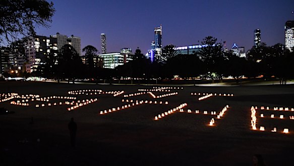 'I can't breathe' spelt out in candles at Musgrave Park.