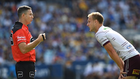 Please explain: Daly Cherry-Evans and referee John Sutton have a chat during round seven.