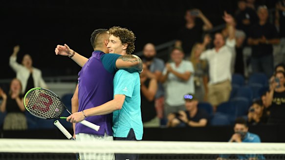 Nick Kyrgios and Ugo Humbert embrace.