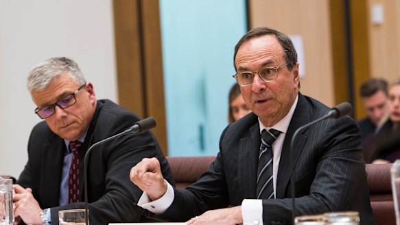 7-Eleven chief executive officer Angus McKay and chairman Michael Smith give evidence at the senate inquiry into franchising. 