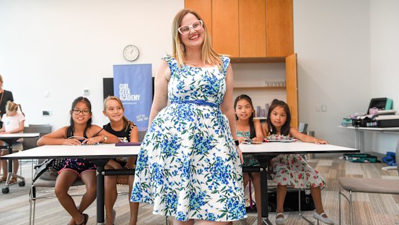 Girl Geek Academy chief executive Sarah Moran and some eager young coders at a Miss Makes Code workshop. 